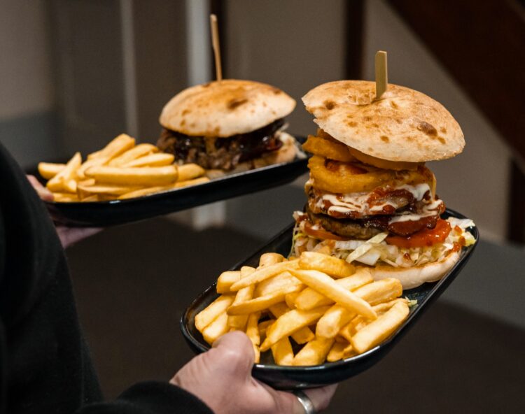 Stacked burgers at the Coopernook Hotel will satisfy that country-style hunger.