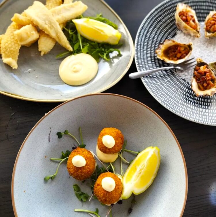 Mouthwatering bites from Thirty Three Degrees at Tuncurry: salt & pepper squid, arancini & Kilpatrick oysters.