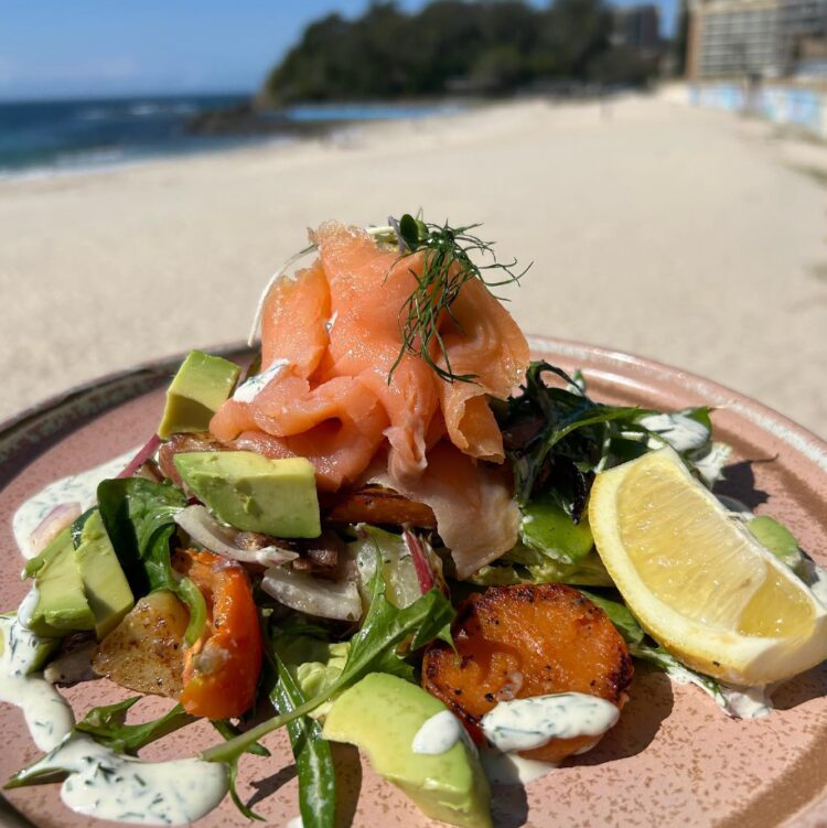 Brunch by the beach at Beach Bums Cafe with a salad of warm potato, avocado and smoked salmon with dill cream.