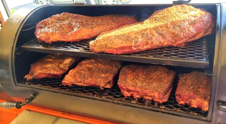 Beef brisket and ribs in the smoker at Benchmark On Booner at Hawks Nest.